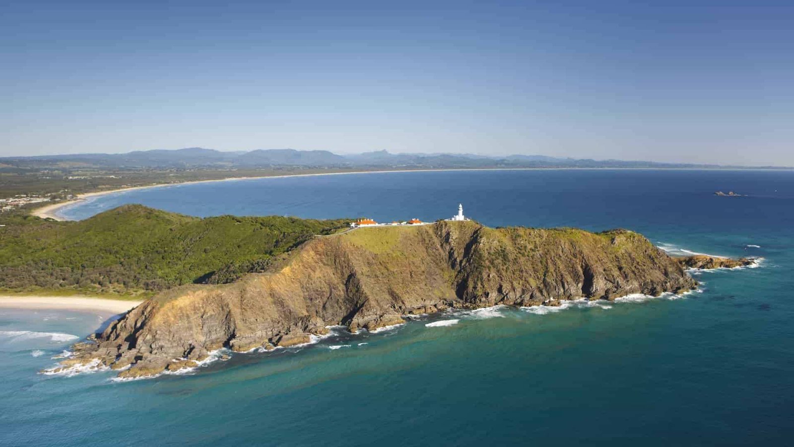 Cape Byron headland and lighthouse from the air, with Tallow Beach running south